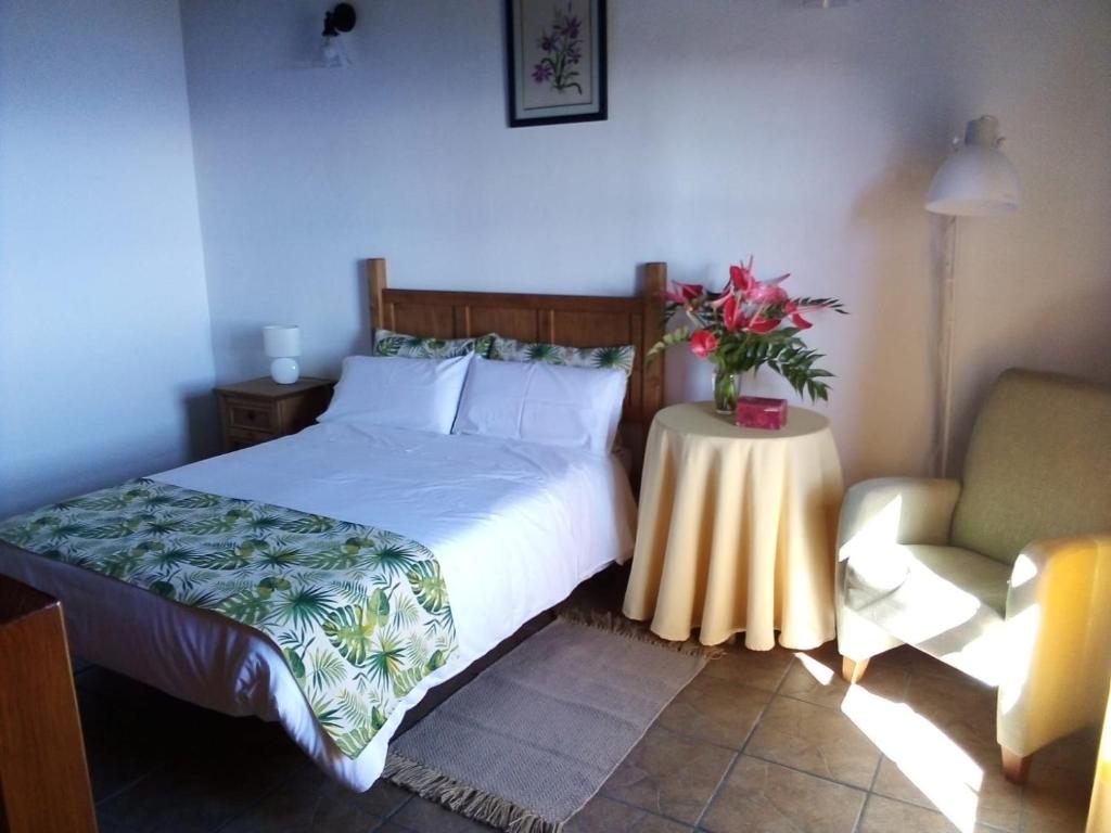 Een bed of bedden in een kamer bij Casa El Caldero