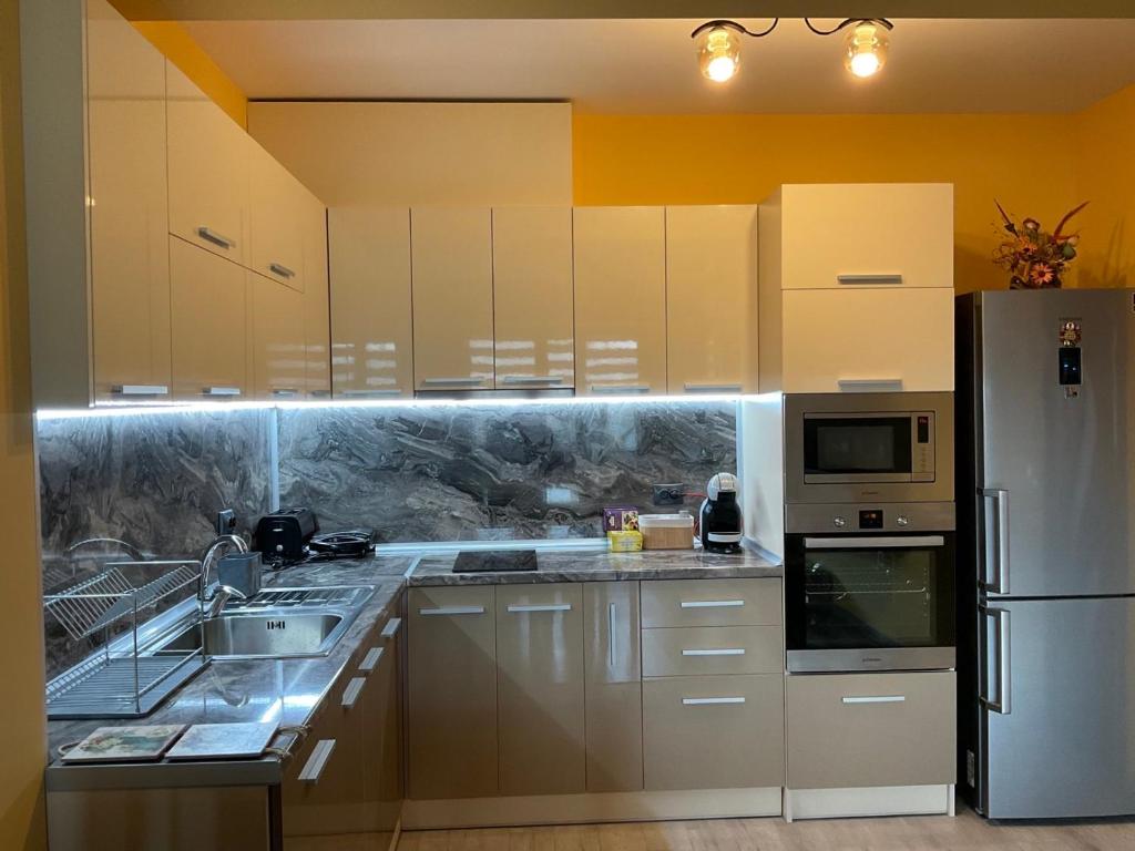 Kuchyň nebo kuchyňský kout v ubytování Nataly Homes