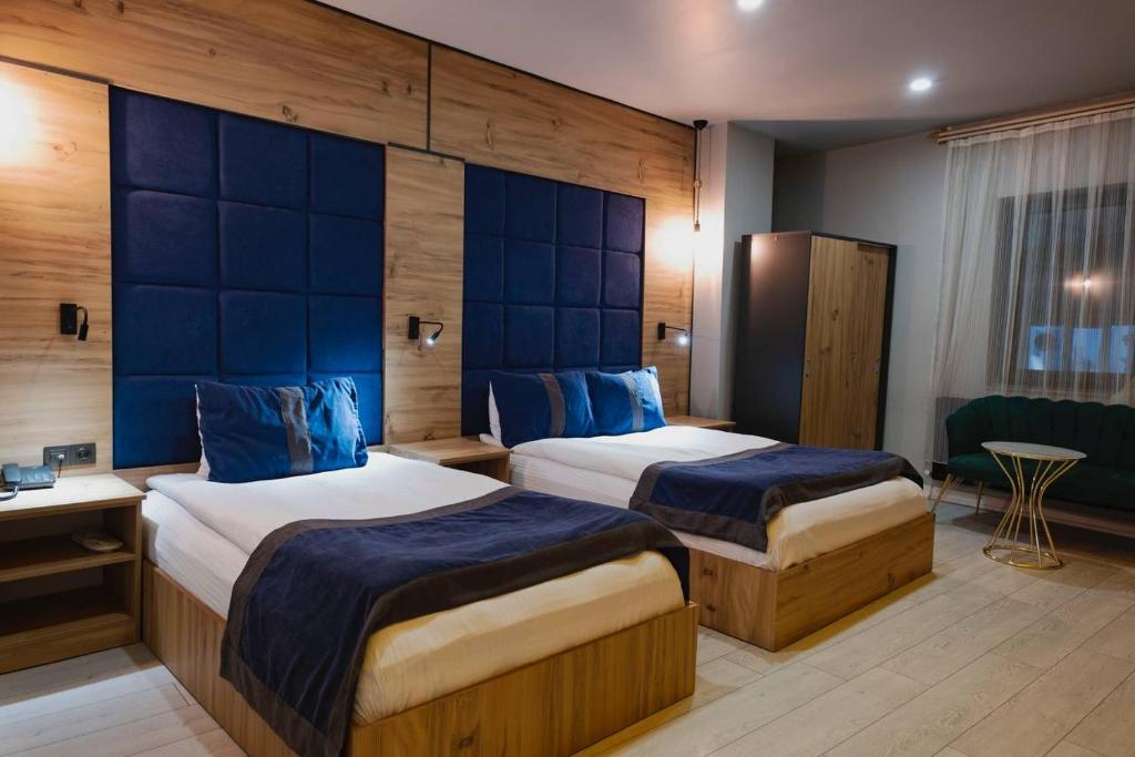 A bed or beds in a room at Grand Catalkaya Hotel