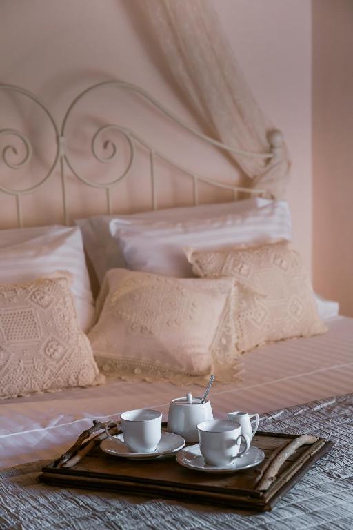 A bed or beds in a room at Traditional Stone House Anofli 1843 Fiskardo Kefalonia