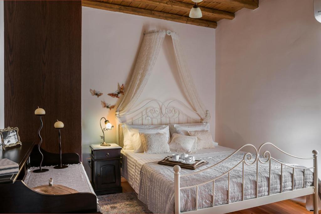 A bed or beds in a room at Traditional Stone House Anofli 1843 Fiskardo Kefalonia