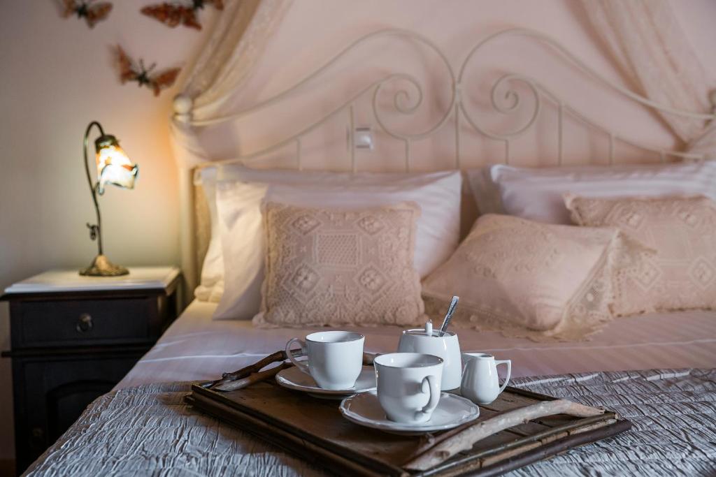 A bed or beds in a room at Traditional Stone House Anofli 1843 Fiskardo Kefalonia