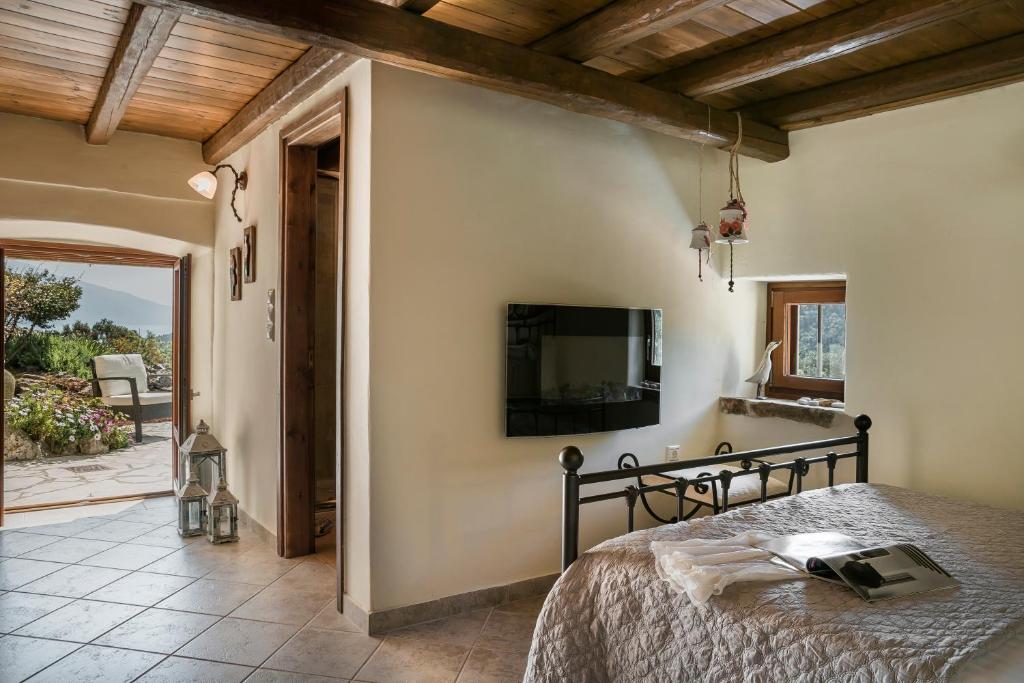A television and/or entertainment centre at Traditional Stone House Anofli 1843 Fiskardo Kefalonia