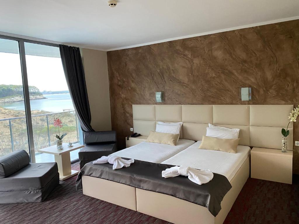 Postel nebo postele na pokoji v ubytování Hotel Kamenec