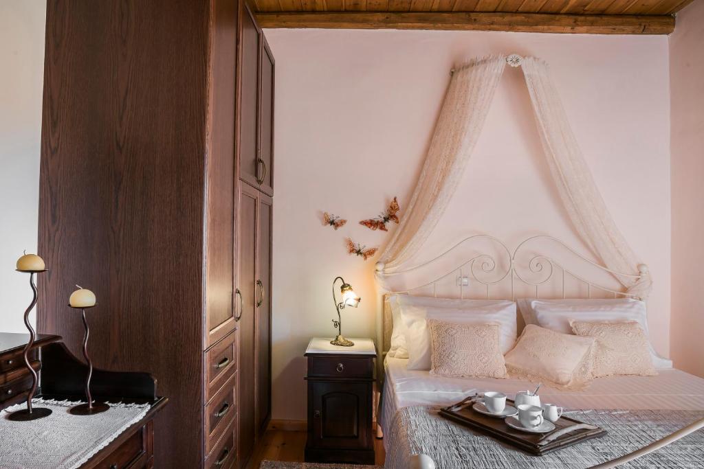 A bed or beds in a room at Traditional Stone House Anofli 1843 Fiskardo Kefalonia