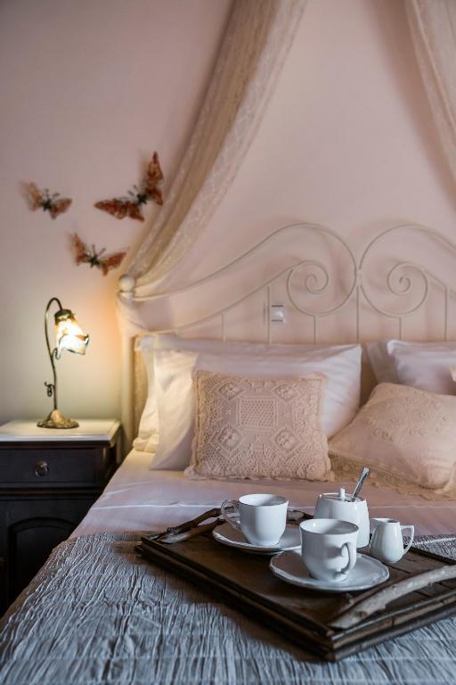 A bed or beds in a room at Traditional Stone House Anofli 1843 Fiskardo Kefalonia