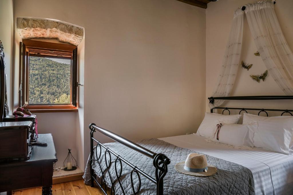 A bed or beds in a room at Traditional Stone House Anofli 1843 Fiskardo Kefalonia