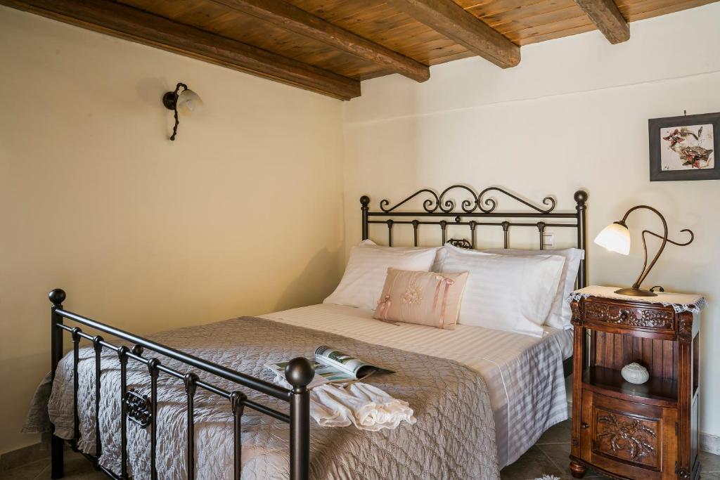 A bed or beds in a room at Traditional Stone House Anofli 1843 Fiskardo Kefalonia