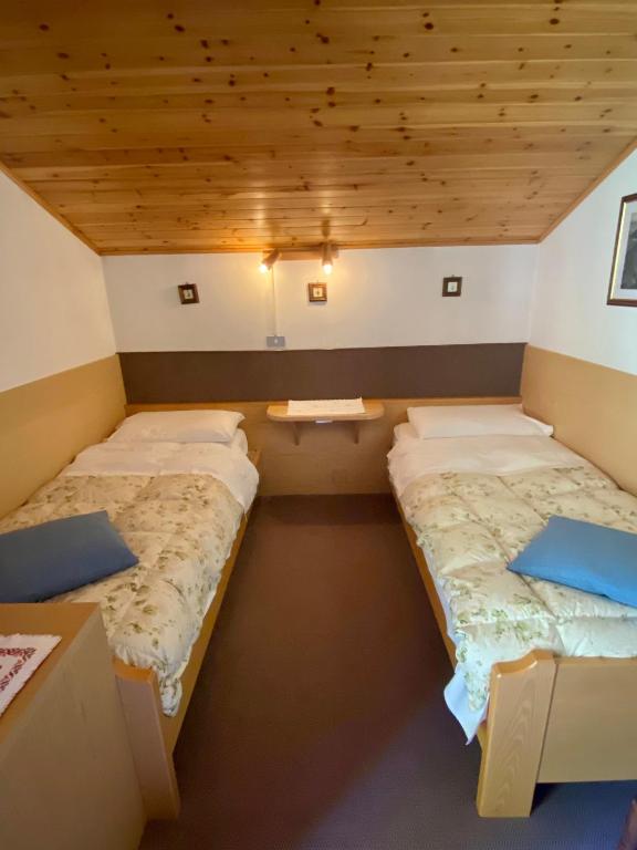 Postel nebo postele na pokoji v ubytování Garni al Barance