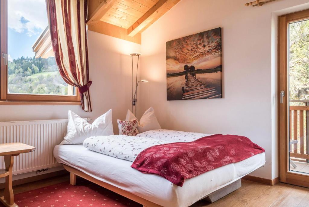Postel nebo postele na pokoji v ubytování Huberhof App Rubens