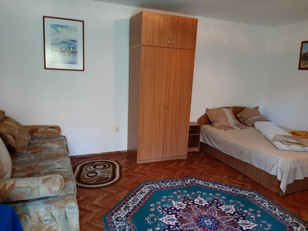 Postel nebo postele na pokoji v ubytování Pensiunea Sapte Pini