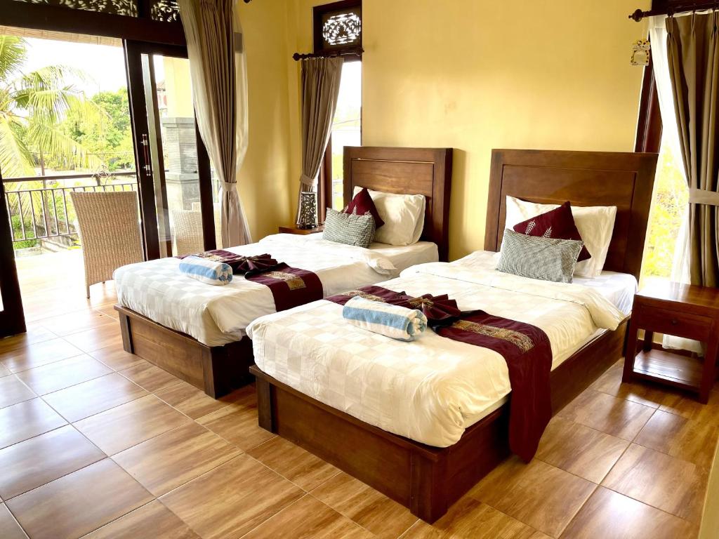 Postel nebo postele na pokoji v ubytování PGS HOME STAY