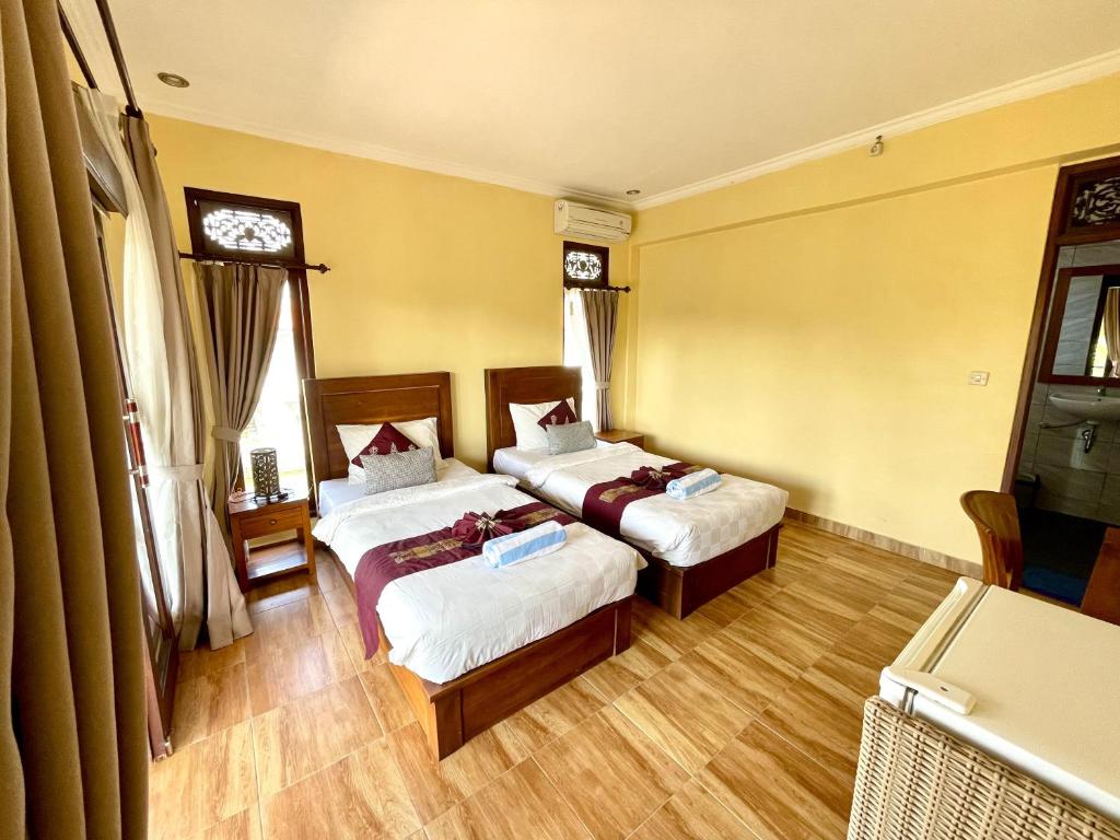 Postel nebo postele na pokoji v ubytování PGS HOME STAY