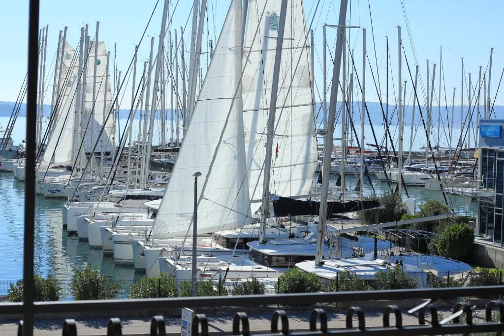 a bunch of sailboats docked in a harbor at Apartment Gallery in Kaštela