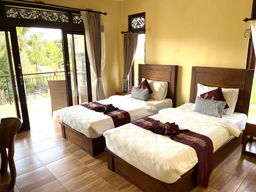 Postel nebo postele na pokoji v ubytování PGS HOME STAY