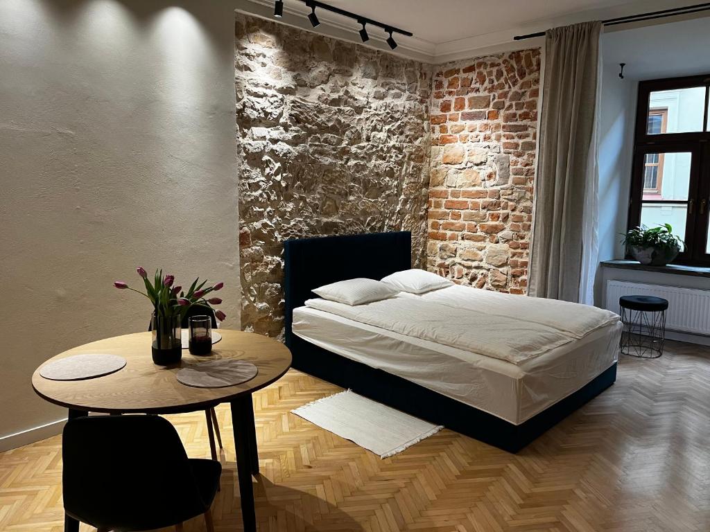 Postel nebo postele na pokoji v ubytování Apartamenty Rynek 5
