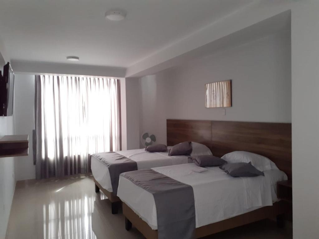 Postel nebo postele na pokoji v ubytování Hotel Terrazas Del Mar