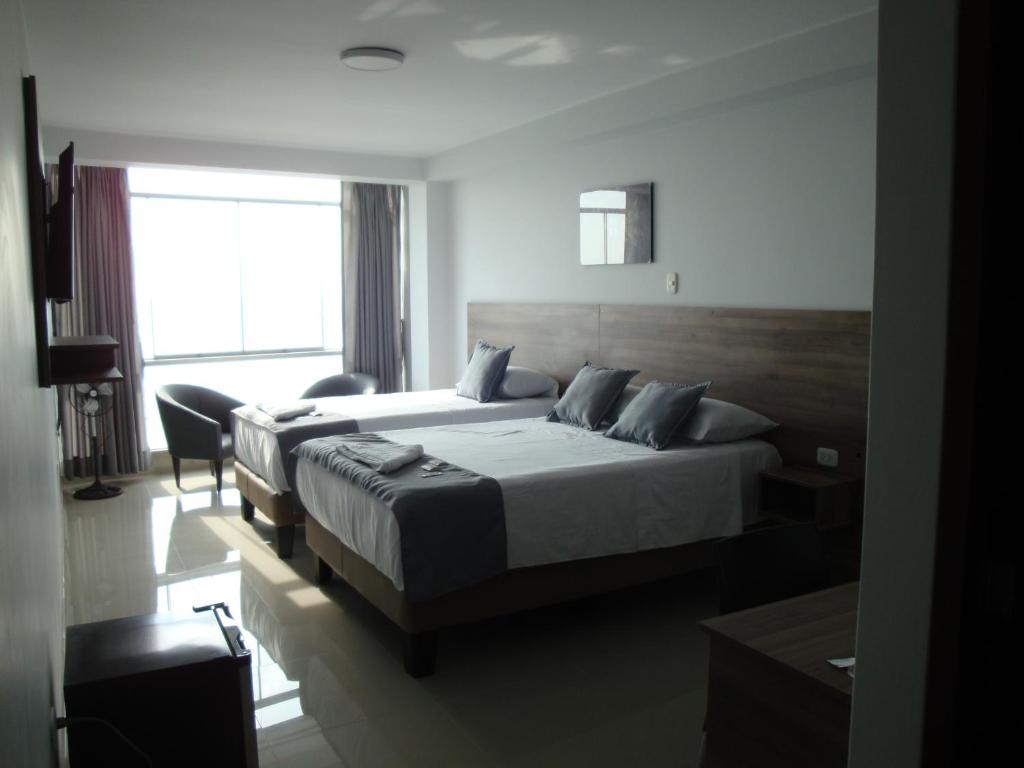 Postel nebo postele na pokoji v ubytování Hotel Terrazas Del Mar