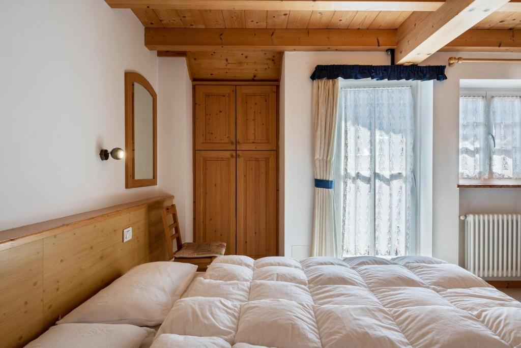 Postel nebo postele na pokoji v ubytování Cesa de Agnese