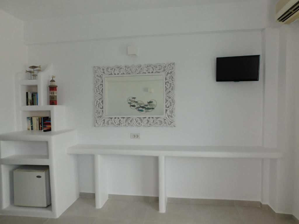 TV a/nebo společenská místnost v ubytování Nikolas Hotel