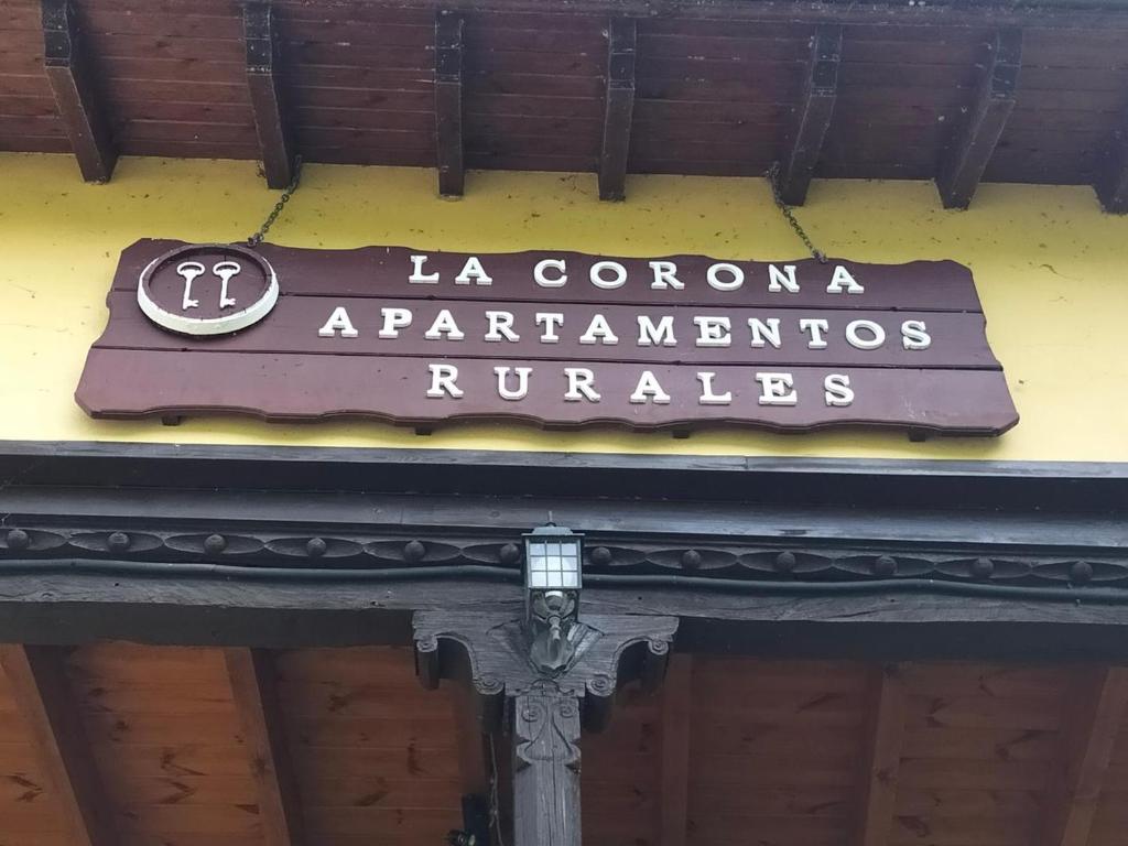 a sign on the side of a building at Apartamentos La Corona in Parres de Llanes