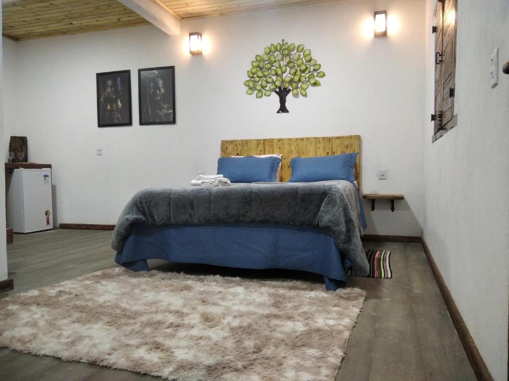 Ένα ή περισσότερα κρεβάτια σε δωμάτιο στο Chalé Suite do chá