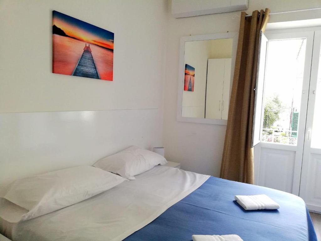 Postel nebo postele na pokoji v ubytování Residence Nina