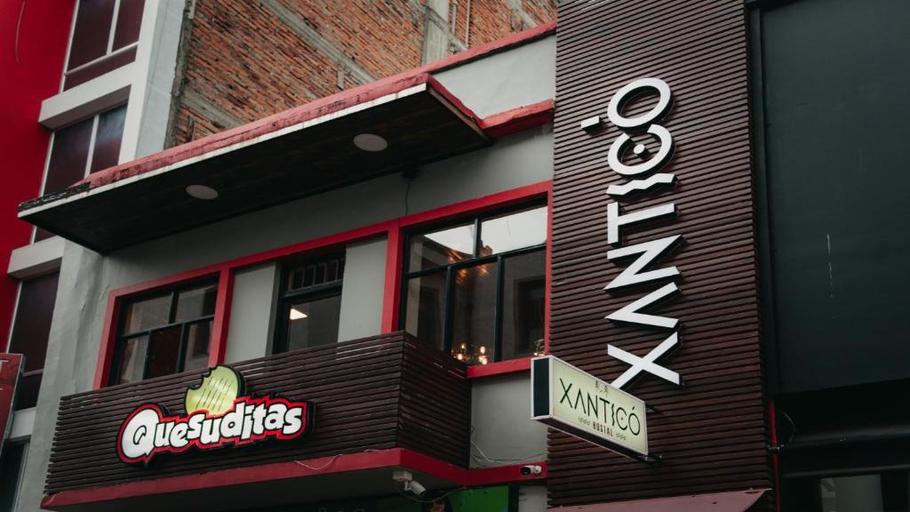 a fast food restaurant with a sign on the side of a building at XanticoHostal in Ipiales