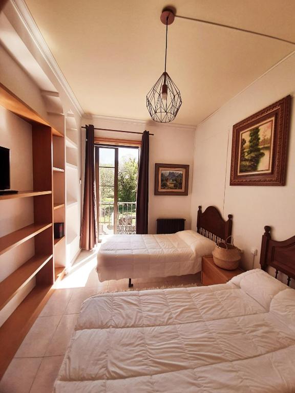 Postel nebo postele na pokoji v ubytování Albergue Villa San Clemente