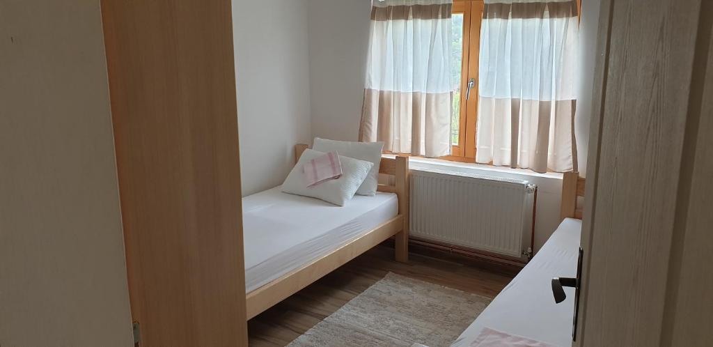 Postel nebo postele na pokoji v ubytování Apartman Djekovic