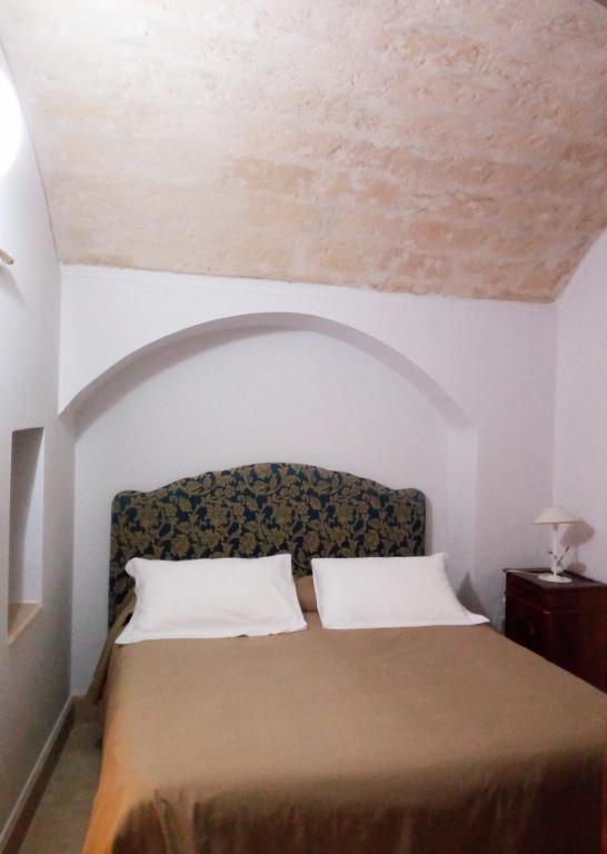 Postel nebo postele na pokoji v ubytování Palazzo Bernardini B & B