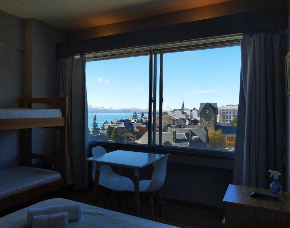 a room with a large window with a view at Center Vistas in San Carlos de Bariloche