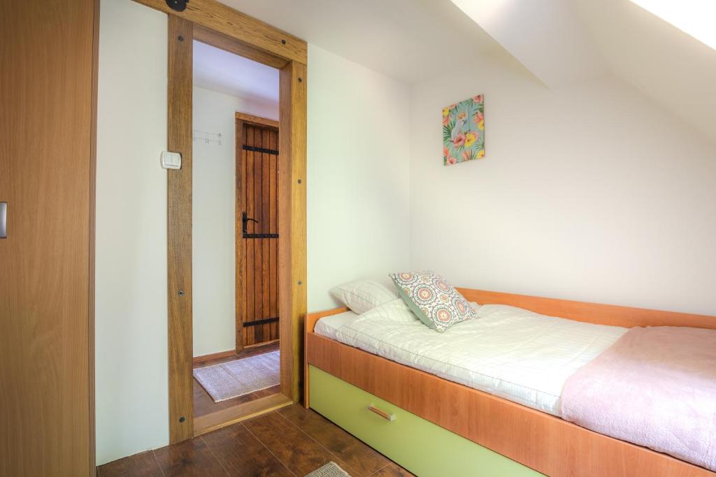 Postel nebo postele na pokoji v ubytování Vila Dunjarica