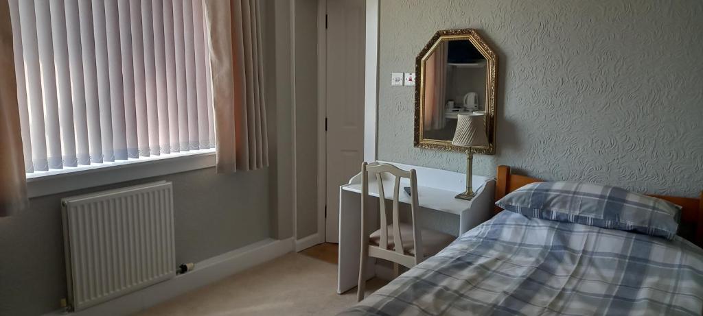 Postel nebo postele na pokoji v ubytování CORSBIE VILLA GUEST HOUSE