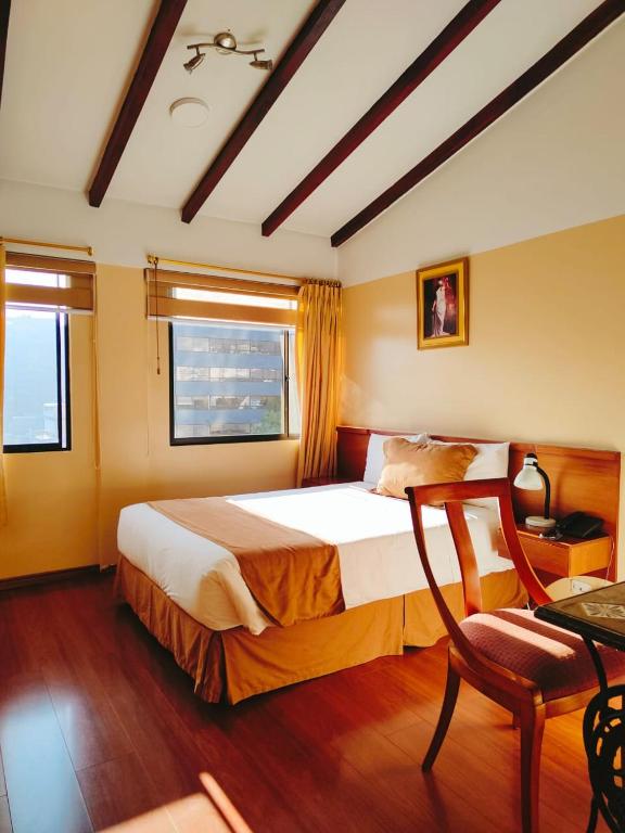 Postel nebo postele na pokoji v ubytování Hotel Carolina Montecarlo
