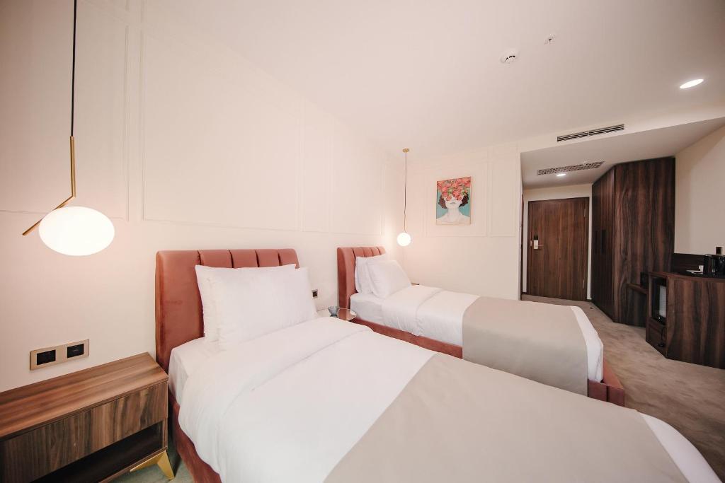 Postel nebo postele na pokoji v ubytování Orden Hotel