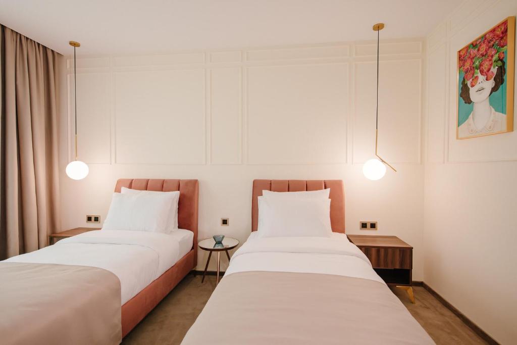Postel nebo postele na pokoji v ubytování Orden Hotel