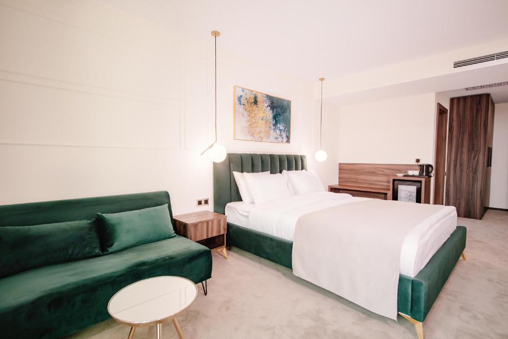 Postel nebo postele na pokoji v ubytování Orden Hotel
