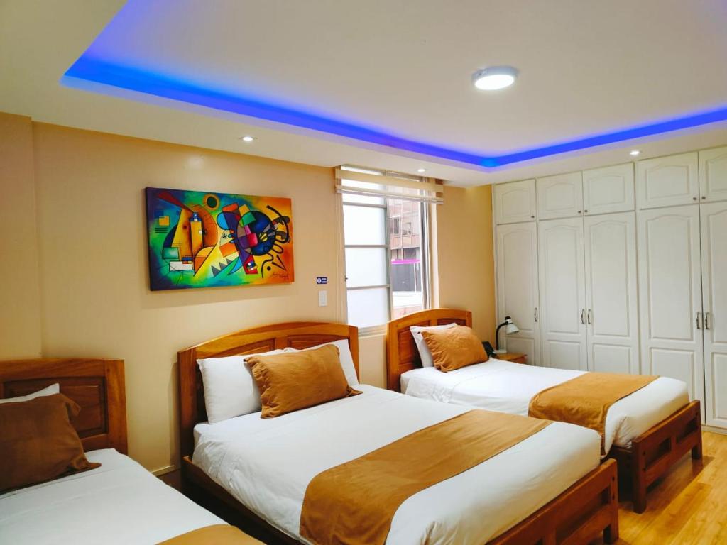 Postel nebo postele na pokoji v ubytování Hotel Carolina Montecarlo