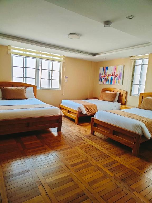 Postel nebo postele na pokoji v ubytování Hotel Carolina Montecarlo