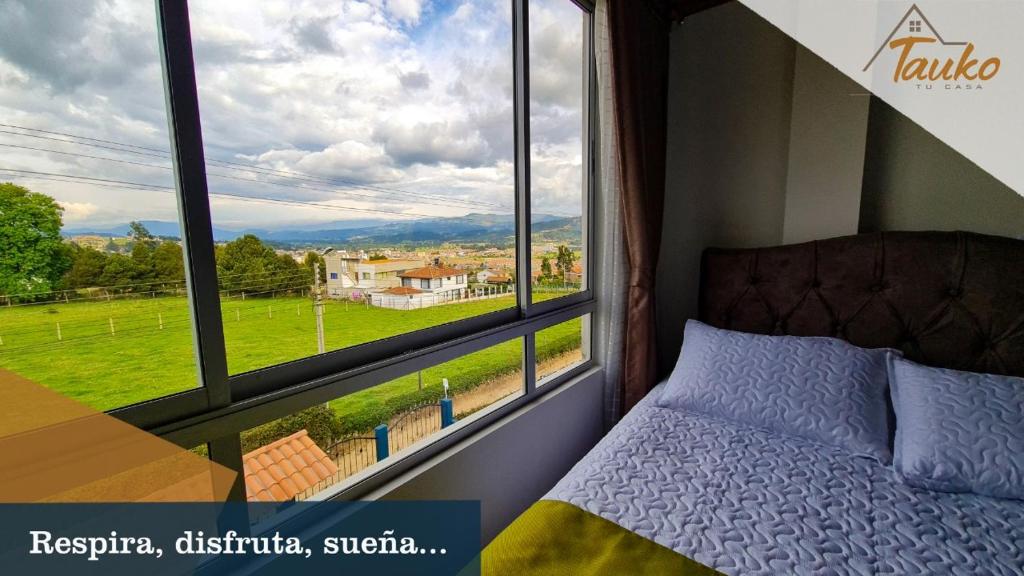 Postel nebo postele na pokoji v ubytování Tauko Tú Casa