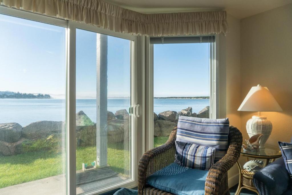 a living room with a view of the ocean at Dock of The Bay #105 in Lincoln City