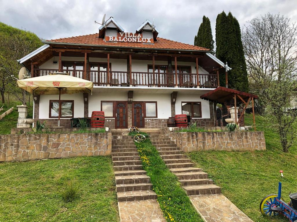 a large house with a staircase in front of it at Villa Balconlux - Zavojsko jezero, Pirot in Pirot