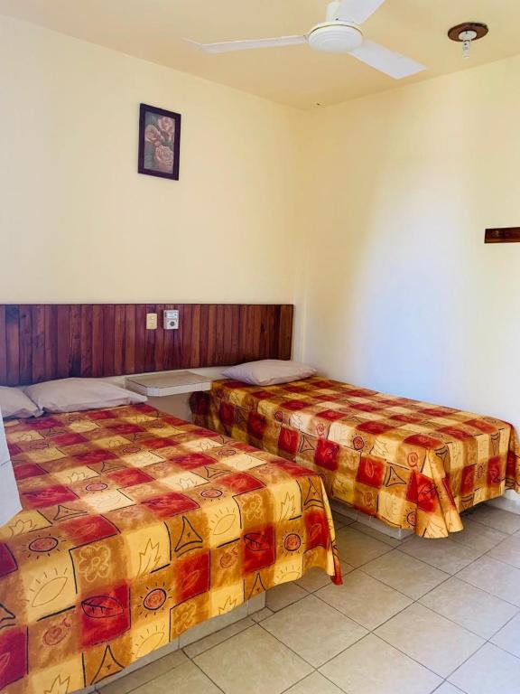 Postel nebo postele na pokoji v ubytování Hotel Sociedad y Maristas