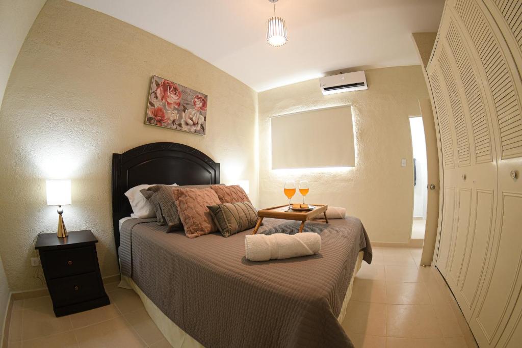 Postel nebo postele na pokoji v ubytování The Cozy Apartment