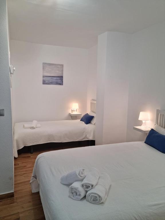 Postel nebo postele na pokoji v ubytování Hostal Nerjasol