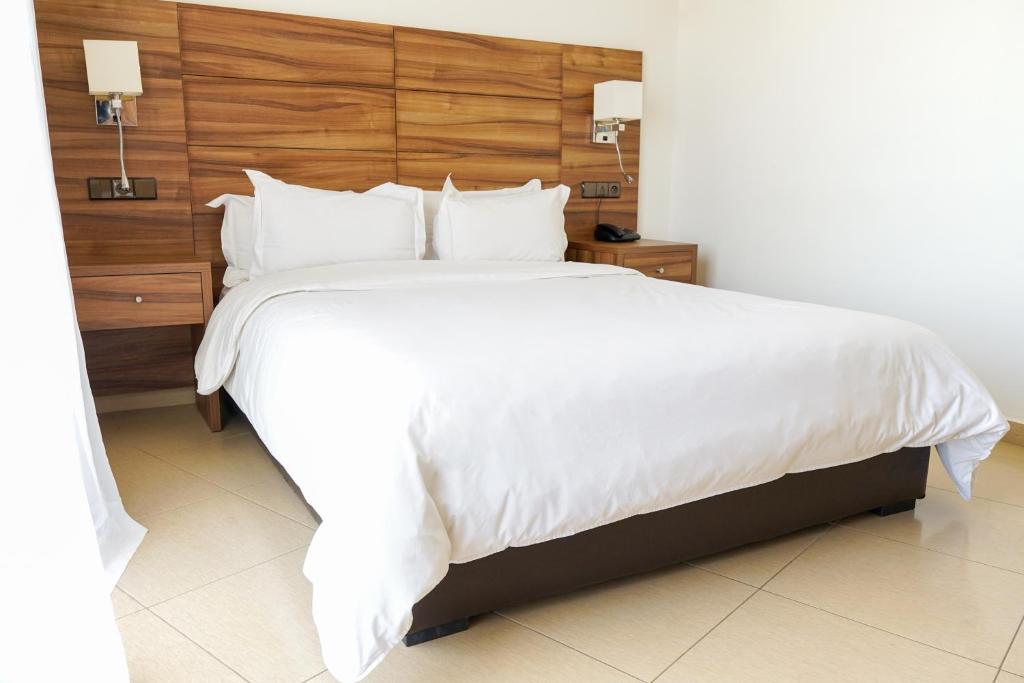 Postel nebo postele na pokoji v ubytování Hotel El Djenina