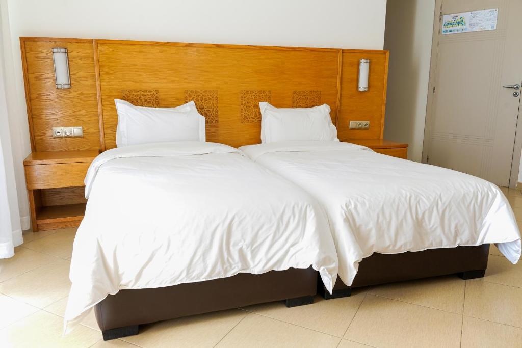 Postel nebo postele na pokoji v ubytování Hotel El Djenina