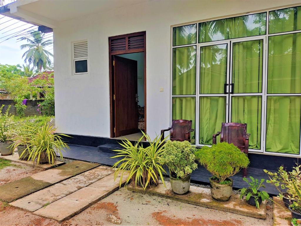 Zahrada ubytování Sandy Palms Guesthouse