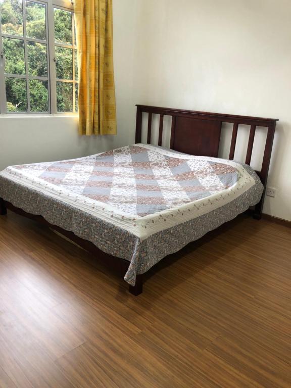 Кровать или кровати в номере Crown Imperial Court Apt at Brinchang Centre